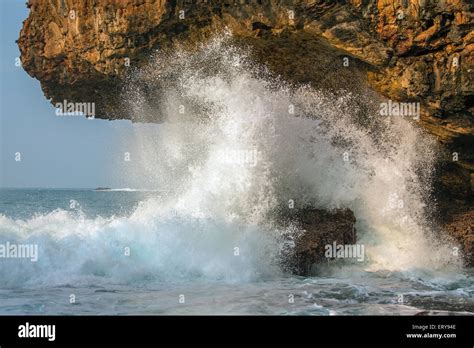 A Splashing Big Wave Crashing Into The Rocks In The Rough Wild Sea