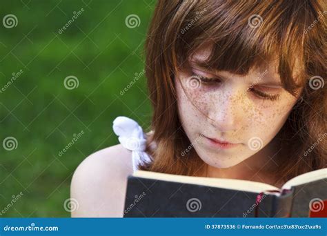 Young Beautiful Girl Reading A Book Outdoor Stock Photo Image Of