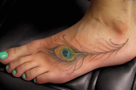 These feather tattoos can also be used as a side tattoo to give a good backing for any lettering tattoos or otherwise can be used as a major single tattoo as it can be made in several colors and interesting designs. Gorgeous peacock feather foot tattoo. | tattoos | Pinterest