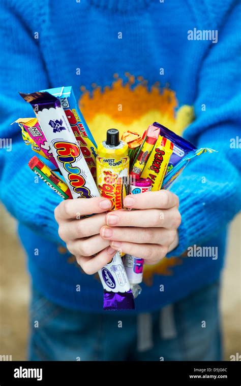 Holding Candy Wrapper Hi Res Stock Photography And Images Alamy