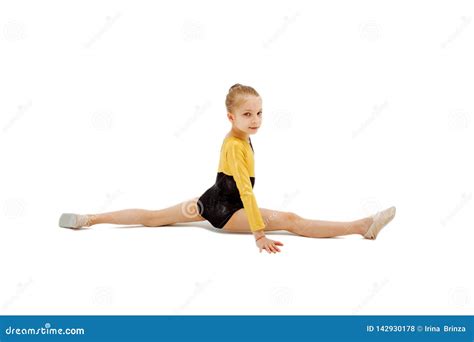 Little Girl Gymnast Sitting In The Splits Isolated On White Stock