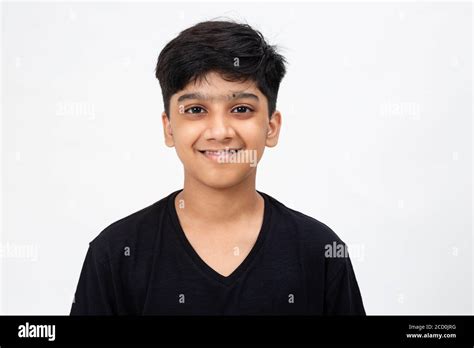 Close Up Pic Of A Cute Indian Boy Adorable Teenager Standing Against