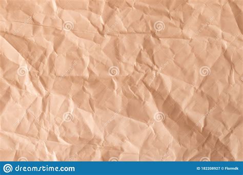 Texture Of A Crumpled Paper In Light Orange Color Empty Background