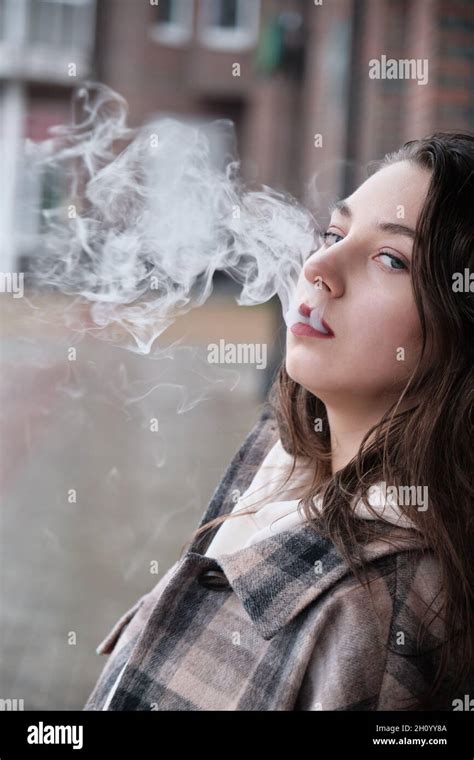Girl Blowing Cigarette Smoke Hi Res Stock Photography And Images Alamy