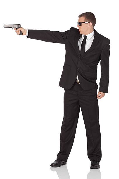 Royalty Free Man Pointing Gun Suit Full Body Pictures Images And Stock