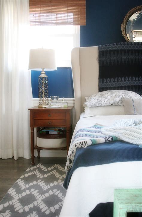 These headboards come as kits. Master Bedroom Makeover // grey rug, navy walls, white ...