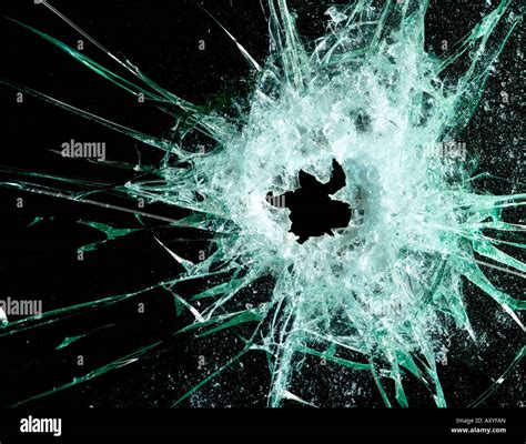 Glass With Bullet Hole Against A Black Background Stock Photo Alamy