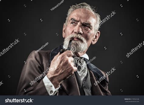 Pipe Smoking Vintage Characteristic Senior Man With Gray Hair And Beard
