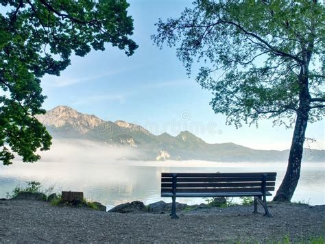 Lake Landscape With A Bench In The Foreground Ready To Relax Stock