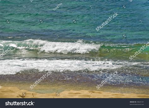 Atlantic Ocean Wave Breaking On Shore In Sand Stock Photo 29825191