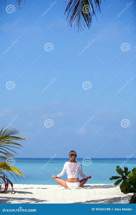 Young Beautiful Healthy Woman Making Meditation On The Beach Stock