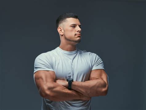 Portrait Of A Muscular Handsome Bodybuilder In Sportswear Standing