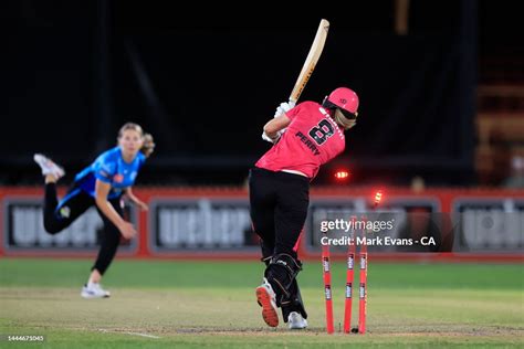 Darcie Brown Of The Strikers Bowls Ellyse Perry Of The Sixers During