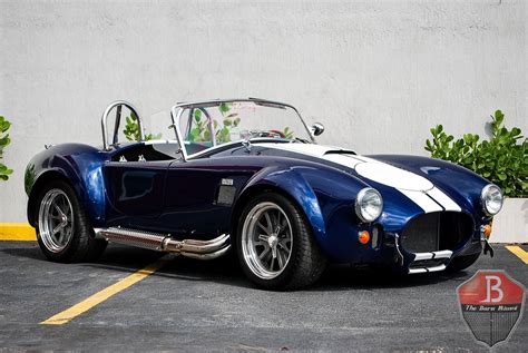 Learn all about its history, performance, & specifications! 1965 Backdraft Racing Roadster | The Barn Miami®