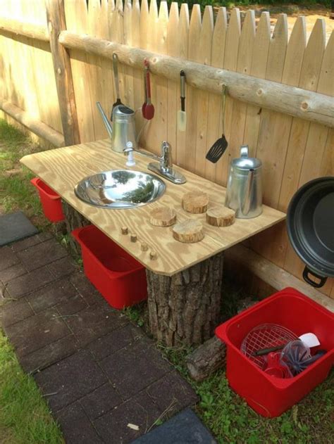 This outdoor kitchen set on a tiles flooring features a long bench seating and a bar with a countertop providing space for the barbecue grill. 15 DIY Ideas How To Transform Your Backyard In A ...