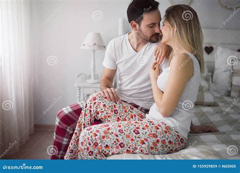 Picture Of Young Attractive Couple Kissing On Bed Stock Image Image