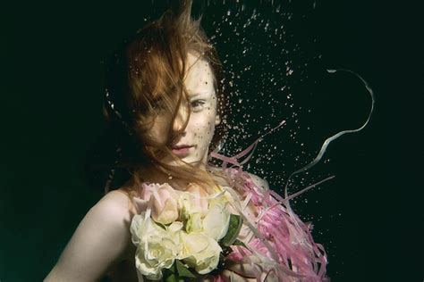 Premium Photo Young Redhead Girl In Dress Made Of Roses Underwater