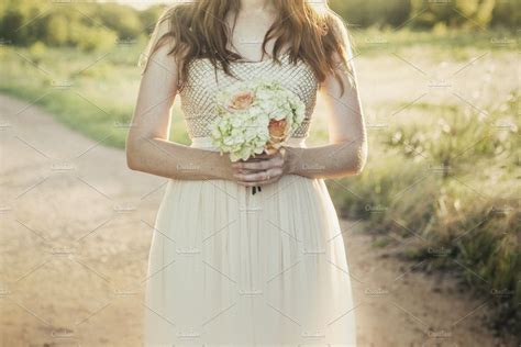 Woman Holding Bouquet Of Flowers ~ People Photos ~ Creative Market