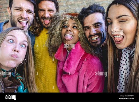 Group Of Best Multiracial Friends Taking A Selfie Outdoor At The City
