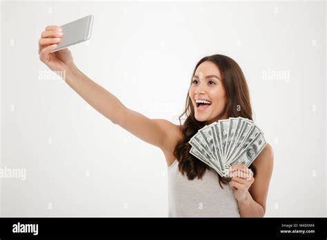 Photo Of Lucky Rich Woman Making Selfie On Silver Mobile Phone While