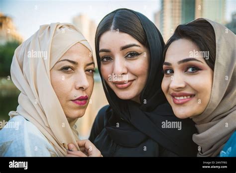 Arabic Women With Abaya Bonding And Having Fun Outdoors Happy