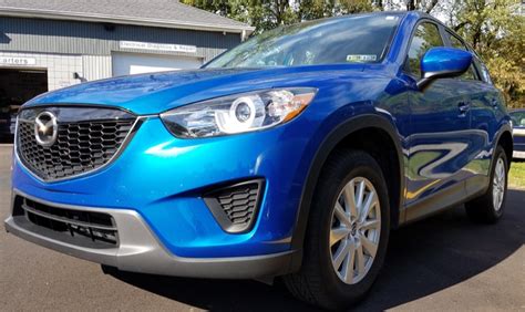 Remove the key from the fob by pushing the tiny switch and pulling on the key ring. Mazda CX-5 Remote Car Starter Makes Great Gift for Erie Client