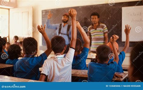 Students Raising Their Hands In A Classroom Editorial Photo Image Of