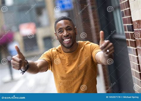 Happy Young African American With A Thumbs Up Gesture Stock Photo
