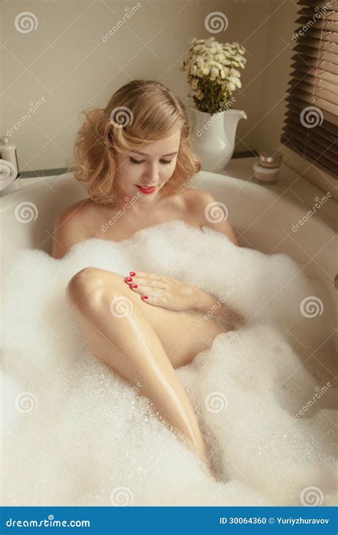 Elegant Beautiful Woman Relaxing In A Spa Bath Royalty Free Stock Image