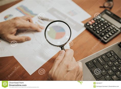 Magnifying Glass Analyzing Business Financial Data. Stock Image - Image ...