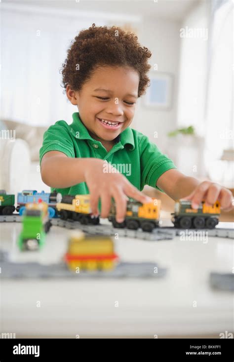 Black Boy Playing With Toy Trains Stock Photo Alamy