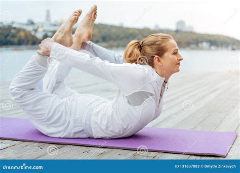 Young Woman Laying In Bow Yoga Pose Stock Image Image Of Activity