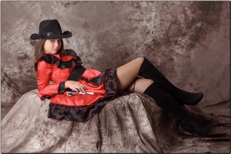 Kleofia Model Lying Down Hat Pose Hands Legs Wearing Boots