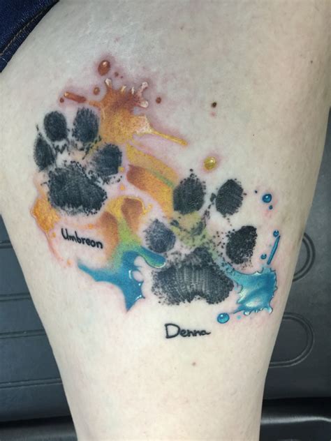 Paw Prints With A Watercolor Background Pawprint Tattoo Dog Paw Tattoo