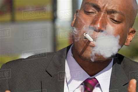 African American Businessman Smoking Cigarette Stock Photo Dissolve