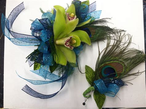 peacock themed corsage and boutonniere bout the corsage is made with green mini cymbidium