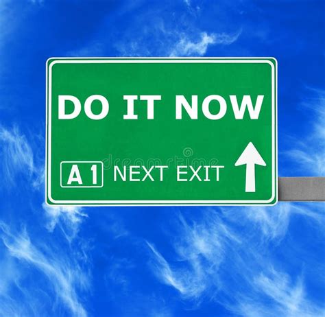 Do It Now Road Sign Against Clear Blue Sky Stock Photo Image Of