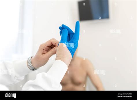 Doctor Urologist Puts A Medical Glove On The Arm To Examine The Patient S Prostate Prostate