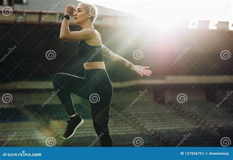 Female Athlete Doing Warm Up Exercises In A Stadium Stock Image Image Of Outdoor Motion