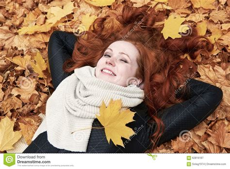 Redhead Girl Lying On Leaves In City Park Fall Season Stock Image Image Of Lying Blink 62816187