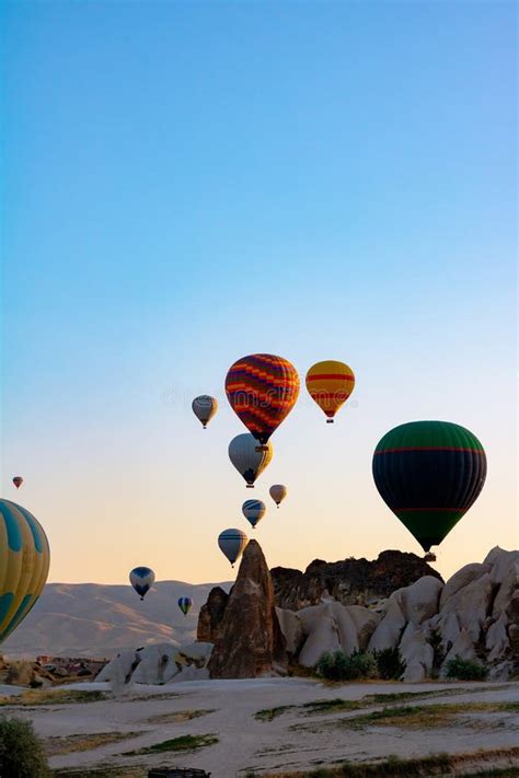 Hot Air Balloons And Fairy Chimneys In Cappadocia Turkey Stock Photo