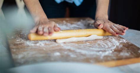 Person Holding Brown Wooden Rolling Pin · Free Stock Photo