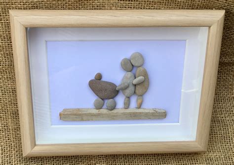 Pebble Picture couple with new baby in pram | Etsy | Pebble pictures, Pebble art, New baby products