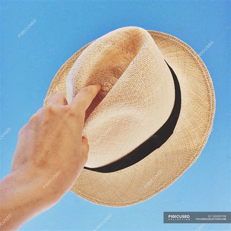 Hand Holding Hat Up To Sky Human Unrecognizable Person Stock Photo