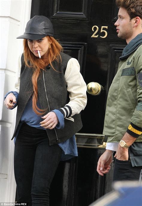 Lindsay Lohan Smokes Amid Fears Naked Photos Could Be Leaked From