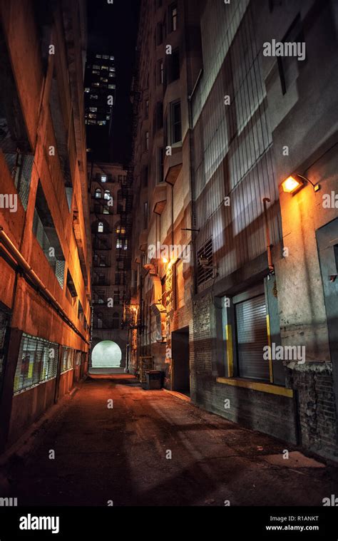 Dark And Eerie Downtown Urban City Alley With A Loading Dock Next To A