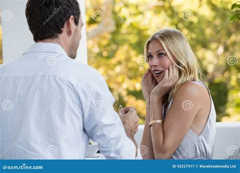 Surprised Woman Looking At Man Proposing Her Stock Image Image Of Hair Attractive 93227977