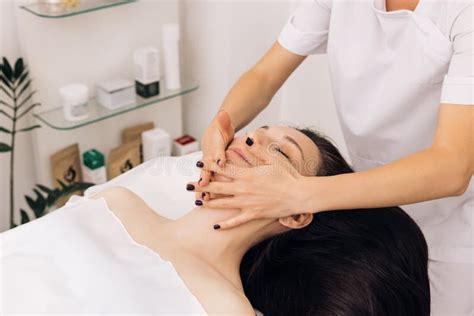 Face Massage In Beauty Spa Salon Caucasian Woman Receiving A Facial