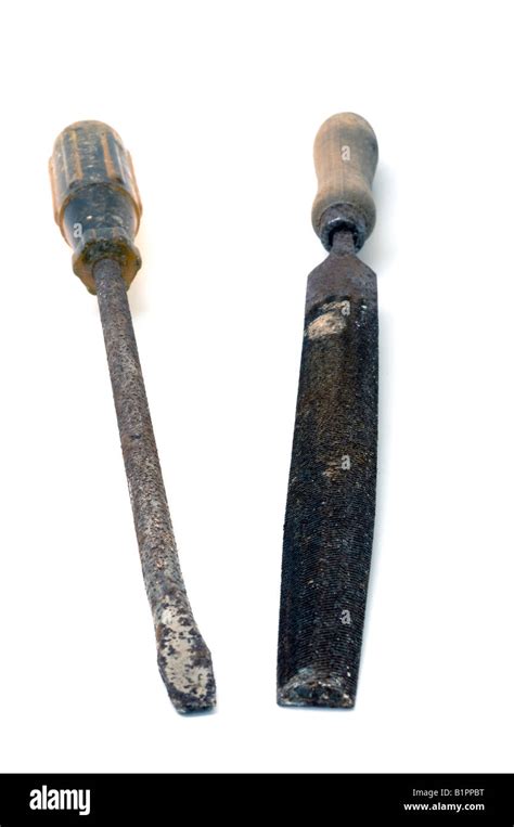 Old Worn Out Rusty Screwdriver And Wooden Handled Half Round File Stock
