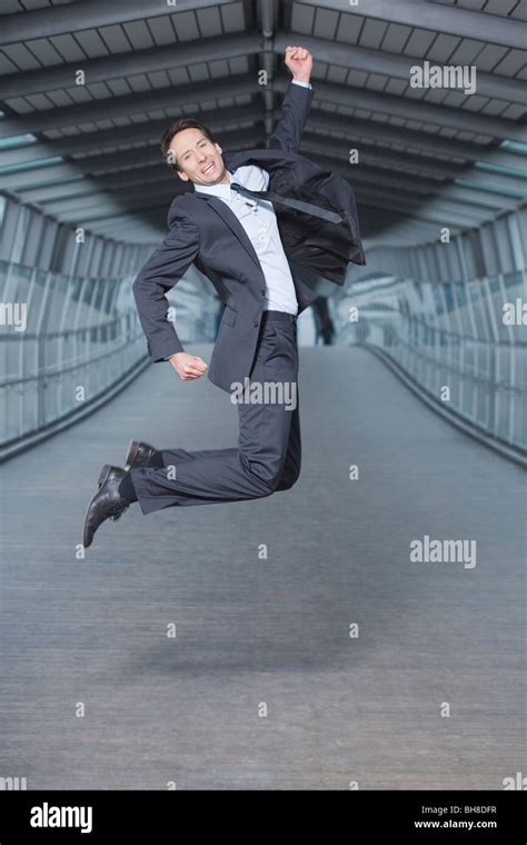 Businessman Jumping Into Air Stock Photo Alamy